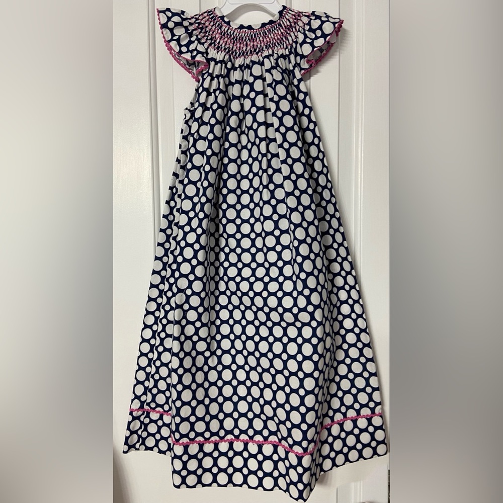 Girls size 6 smocked dress. Worn once. From a non-smoking, pet free home.